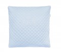 Quilted blue pillow with emblem