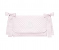 Quilted pink crib bag with emblem 