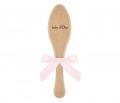Baby hairbrush with a powder bow