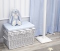 White wicker trunk with grey pillow