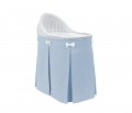Mobile wicker bed with velvet blue skirt
