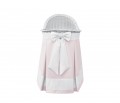 Mobile wicker bed with pink skirt and ecru bow
