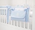 Quilted blue crib bag with emblem