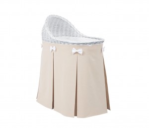 Mobile wicker bed with beige skirt