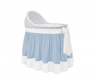 Mobile wicker bed with an blue flounce and a ecru bow