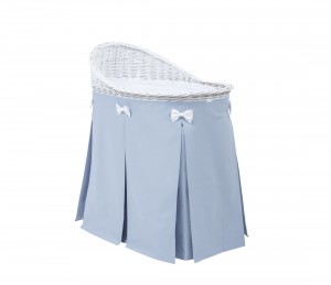 Mobile wicker bed with blue skirt