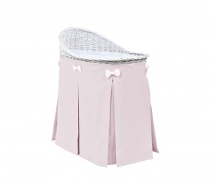 Mobile wicker bed with velvet pink skirt