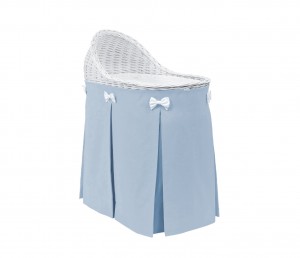 Mobile wicker bed with velvet blue skirt