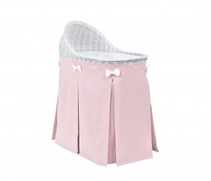 Mobile wicker bed with pink skirt