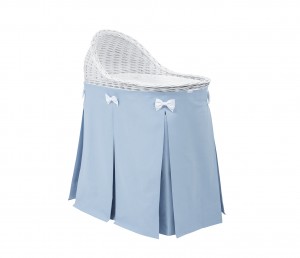 Mobile wicker bed with blue skirt